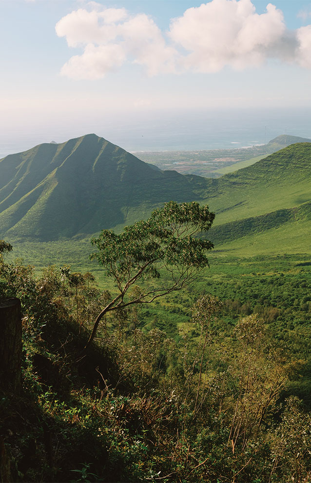 mountainous landscape and blue skies with a few clouds. 