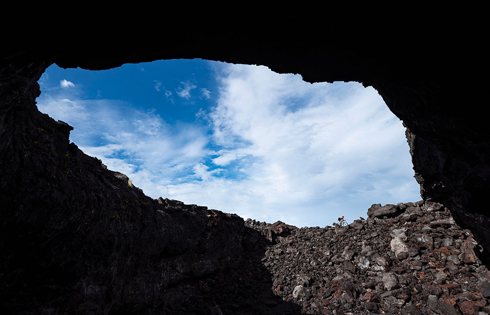 a rocky area with a blue sky and clouds